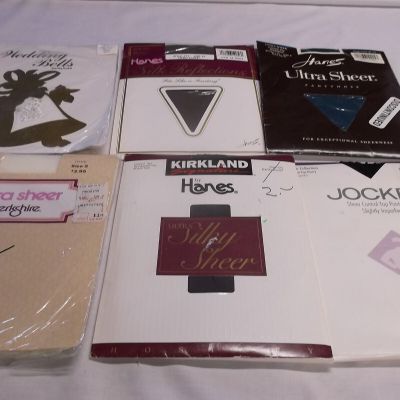 Six pairs of colored panty hose. mixed lot sized C-F packaged
